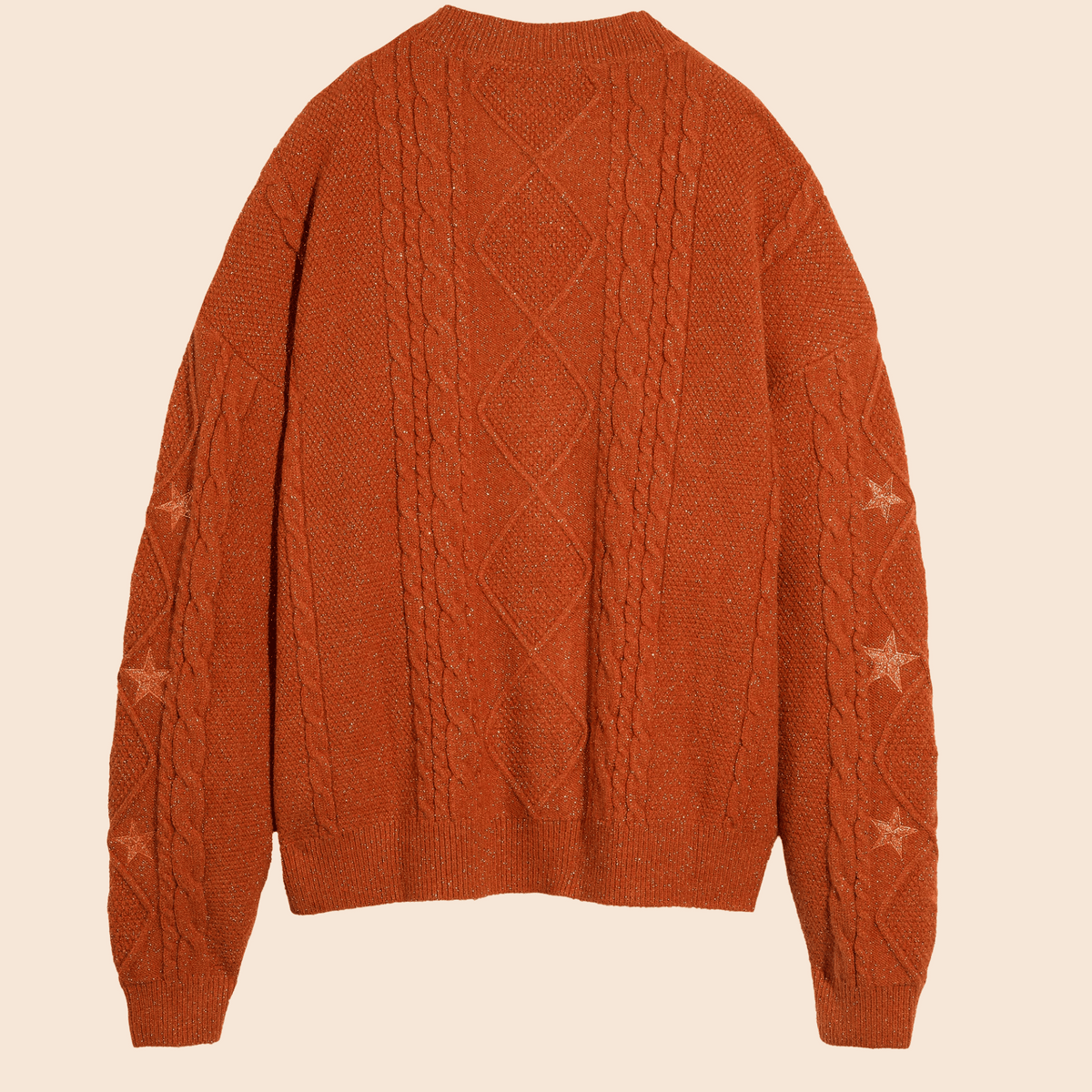 Brown cable knit sweater on a beige background